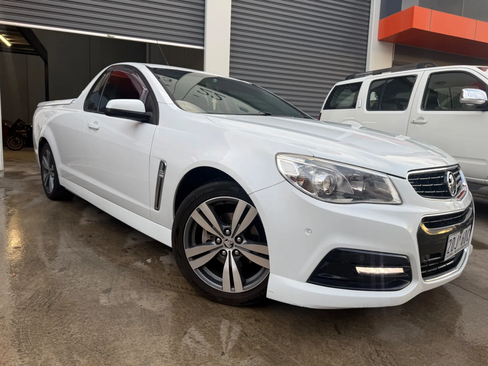 Front three-quarter view of a white 2013 Holden Ute SV6.
